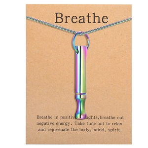 Rainbow metal mindfulness whistle necklace on a kraft card with Breathe text inscription