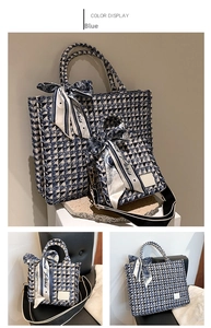 Close-up of blue and white tweed tote bag set with elegant Paris printed ribbon