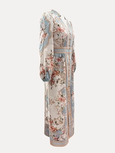 Side view of long-sleeved floral maxi dress with V-neck and button-down detail