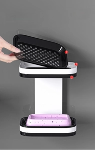 Detail showing the detachable black drainage tray of the double-layer soap holder