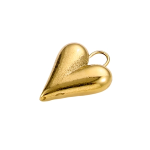 Close-up of polished golden heart-shaped stainless steel pendant with reflective finish