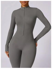 Detail view of dark grey athletic bodysuit with half-zipper collar and snug fitness fabric
