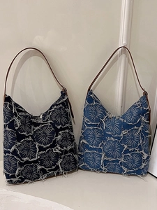 Vintage denim tote bags with fringe flower patterns in dark and light blue colors