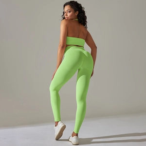Close-up of fluorescent green seamless ribbed knit yoga set with backless halter design