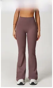 Detailed back view of high-waisted purple flared yoga pants for fitness and sports