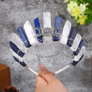 Close-up of handmade crystal crown with blue and white stones on silver headband