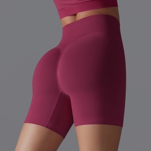 Macro detail of wine red seamless yoga shorts showing high waist and scrunch butt design