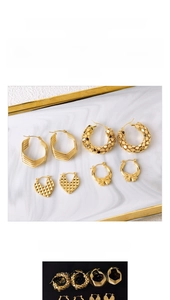 Detail view of gold-plated titanium steel earrings in heart and bow geometric shapes