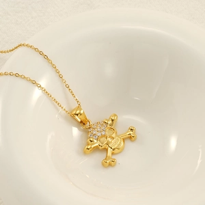 Pendentif tête de mort doré style hip-hop avec strass brillants et fine chaîne réglable