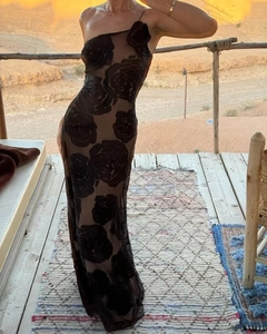 Detail of elegant one shoulder maxi dress with 3D black rose floral appliques and slim fit