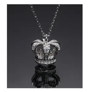 Macro shot of silver S925 crown necklace pendant with pave-set zircon detail
