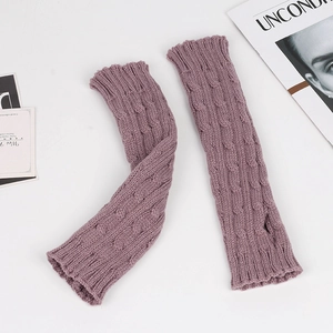 Close-up of purple knit arm warmers with classic cable stitch patterns and thumb holes