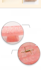 Detailed view of pink marble claw clip with smooth surface and strong metal spring