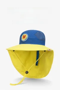Detail of kids sun hat with lion badge, neck flap protection, and mesh ventilation