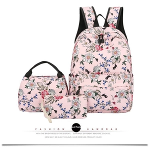 Three-piece backpack set featuring pink floral and bird prints with matching lunch bag