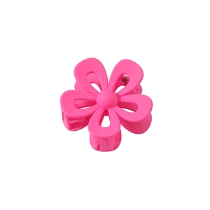 Detail of rose pink matte flower hair claw clip with a five-petal floral design