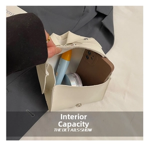Internal view of a cream crossbody bag showing storage capacity for phone and cosmetics