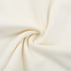Close-up of cream white ribbed knit fabric texture with high density stitching detail