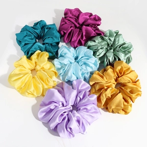 Elegant satin hair scrunchies in seven colors including purple, blue, green and gold