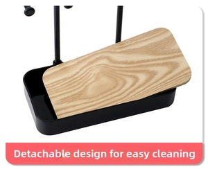 Close-up of detachable light wood tray and black base of the jewelry organizer