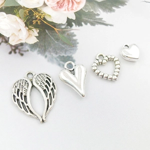 Hollow heart and angel wing silver charms for DIY jewelry making and necklace crafts