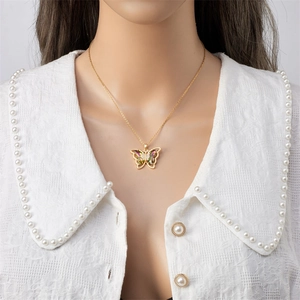 Elegant gold butterfly necklace with gradient colored gemstones on a delicate chain