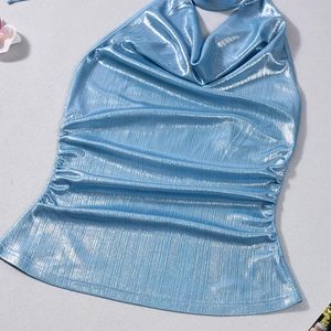 Detail of light blue cowl neck top featuring metallic pleated fabric and halter ties