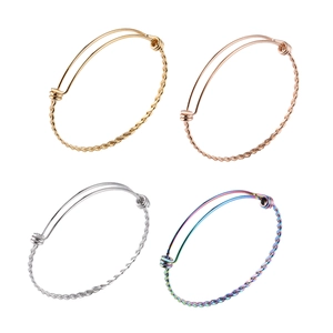 Set of four adjustable twisted cable bangles in gold, rose gold, silver and rainbow colors