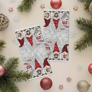Detail of microfiber kitchen towels featuring festive Christmas gnome prints with snowflakes