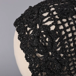 Handmade black crochet headpiece with floral cutouts and shiny silver sequins