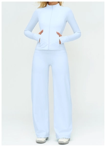 Detailed view of light blue zip-up yoga jacket and matching high-waisted wide-leg pants