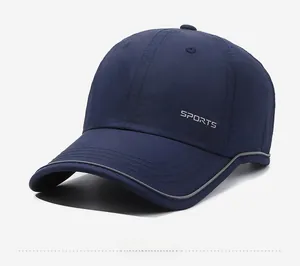 Detail view of breathable navy sports cap with reflective brim and SPORTS embroidery