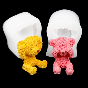3D bear silicone molds with textured yellow and pink resin figures on black background