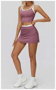 Detailed view of the purple ribbed sports bra and high-waisted tennis skirt set