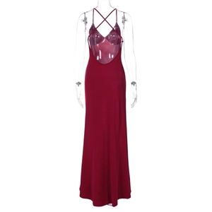Close-up of red ribbed knit dress featuring a deep open back and crisscross straps