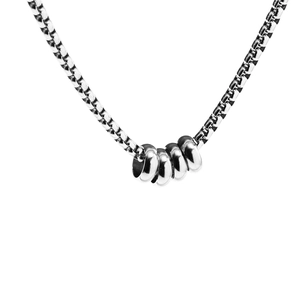 Minimalist silver chain necklace featuring five interlocking circular pendants on white background