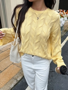 Women's casual light yellow knit sweater with long sleeves in a street style look