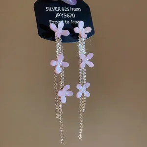 Pink resin flower earrings with silver needles and long rhinestone tassel pendants