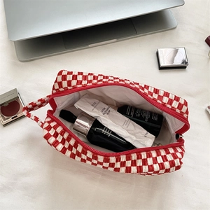 Top view of red checkered velvet cosmetic bag with large capacity and soft quilted texture