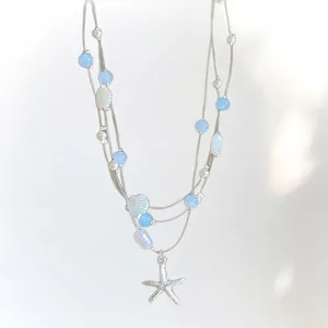 Bohemian multi-layer necklace with blue beads, pearls, seashells and starfish pendant
