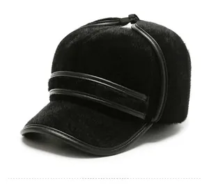 Close-up of winter faux fur trapper hat with leather piping and thick thermal ear flaps