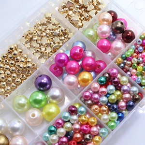 Close-up of DIY jewelry making kit with colorful round, star, and heart-shaped beads in a box