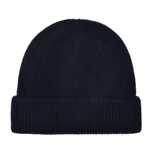 Close-up of navy blue winter beanie with classic ribbed knit pattern and fold-over cuff