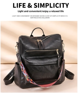 Detail of black soft leather backpack with colorful ethnic style woven shoulder strap