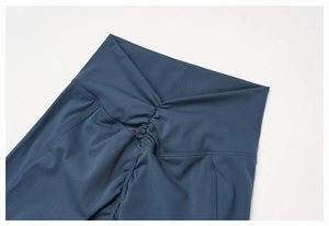 Close-up of high-waisted V-cut yoga leggings with scrunch butt lifting seam detail