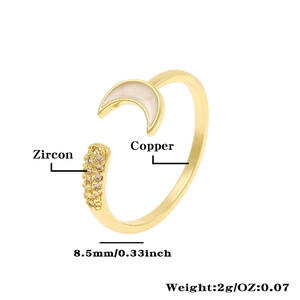 Detail showing copper ring with crescent moon inlay and zircon stones measurement