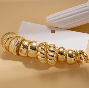 10-piece set of gold geometric C-shaped stud earrings with smooth and hammered textures