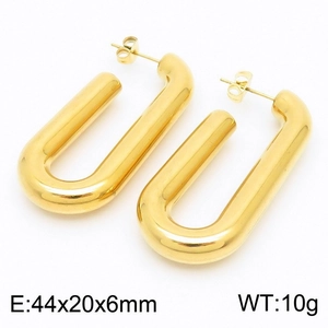 Macro shot of 18k gold plated stainless steel U-shaped hoop earrings with mirror finish