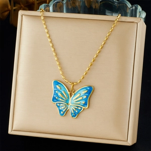Golden butterfly necklace with blue enamel gradient pendant on a stylish bead chain