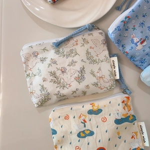 Cute cartoon mini cotton coin purses with bunny and duck patterns in 45-degree view